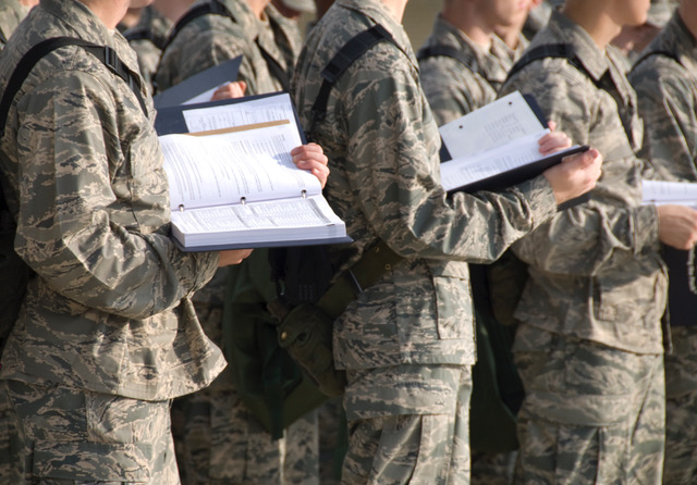 soldiers holding books